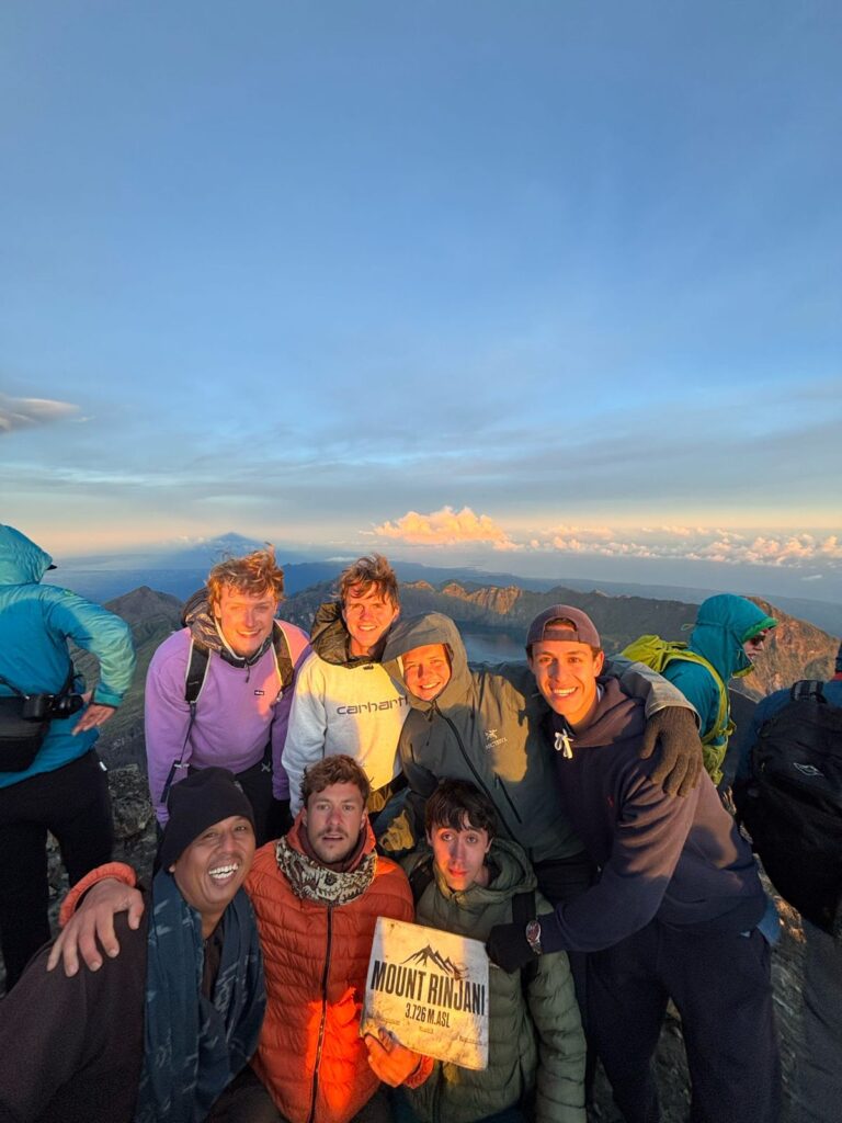 Mount Rinjani 2D1N summit trek with sunrise view from the summit and hikers reaching the top